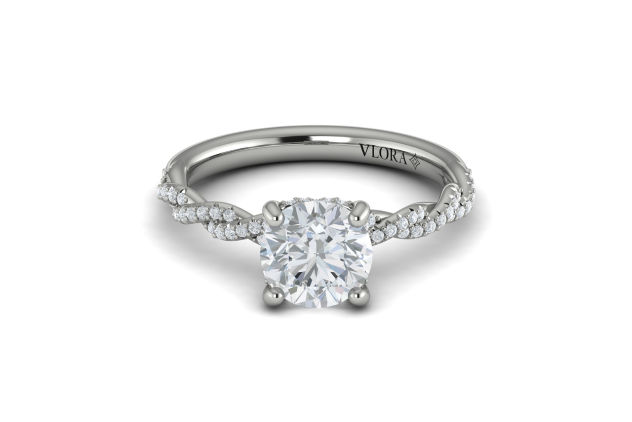A classic solitaire engagement ring with twisted side stones.