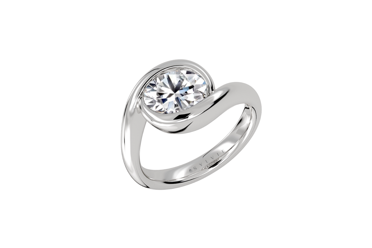 An east-to-west oval-cut bypass engagement ring.