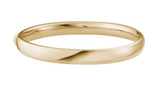 a yellow gold bangle bracelet with a wide band and a hinge on one side