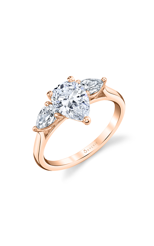 A pear-shaped three stone rose gold engagement ring