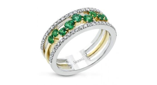 A mixed metal Simon G. fashion ring with diamonds and emeralds, available at Aucoin Hart Jewelers.