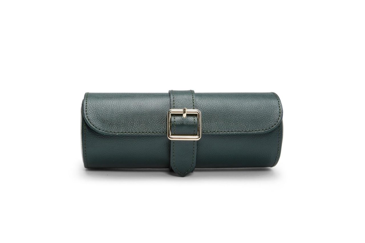 A dark green watch winder with a gold buckle.