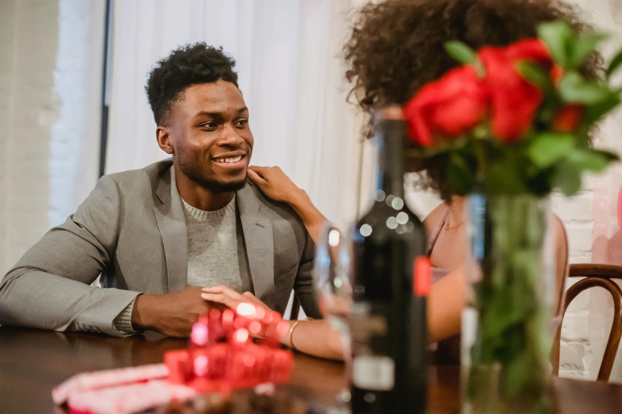 A man and woman having a lovely first date out dining at a restaurant