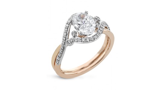 a mixed metal engagement ring featuring curved lines and diamond accents