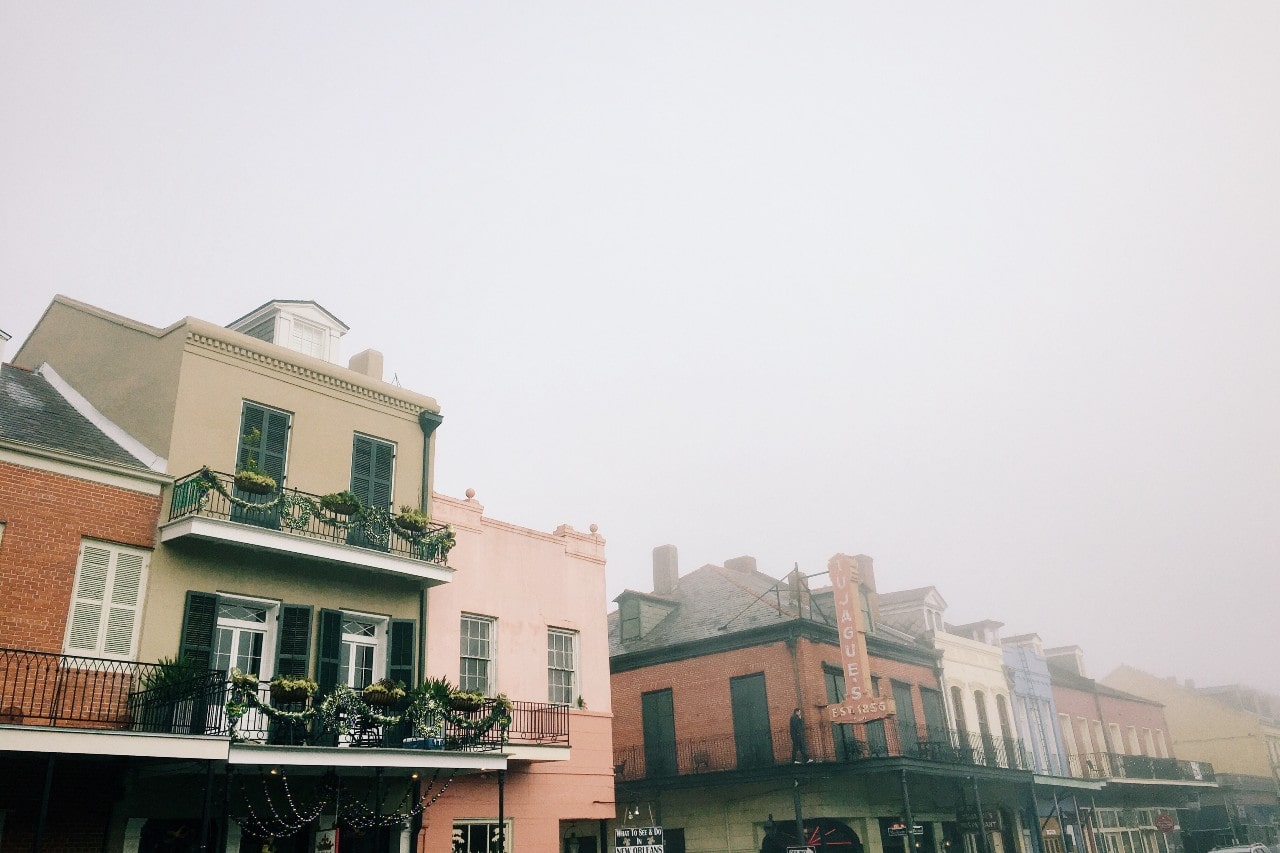a misty image of the tops of building in the French Quarter in New Orleans