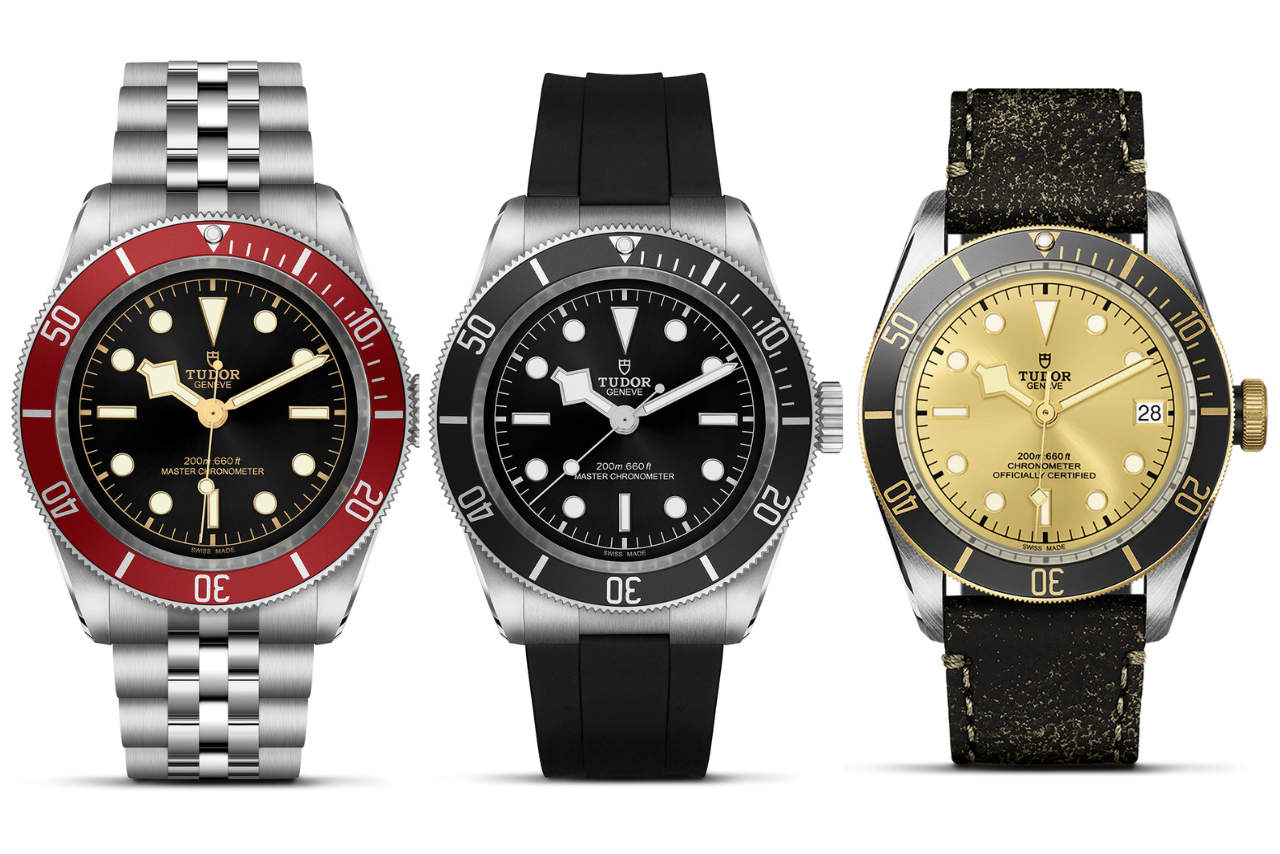 Three TUDOR watches with black and gold dials, one with a metallic bracelet, the other with rubber, and last with leather.