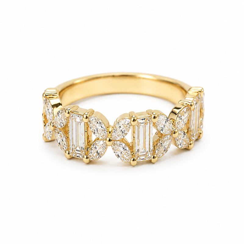Men and women’s wedding bands sitting on a rock.
